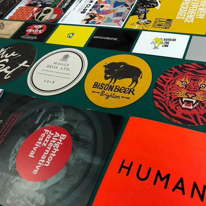 A selection of printed items on a cutting mat