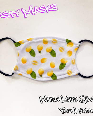 Facemask white background, images across front of lemons, some whole, some half, some with leaves attached